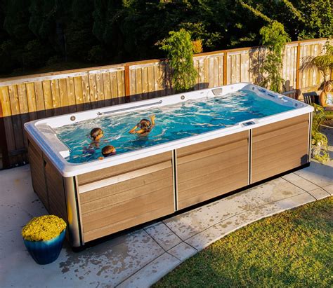 Family leisure pools - The Limitless™. Feature-packed. Compact design. An exciting version of The Ultimate™ in terms of desirable features, this pool is built with a reduction in width, making it the ideal choice for smaller backyards. The Limitless™ knows no bounds, however, in terms of the luxurious swimming experience it will give you.
